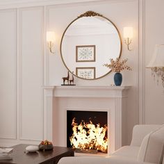 a living room filled with furniture and a fire place in front of a round mirror