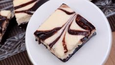 slices of cheesecake with chocolate swirl on a plate