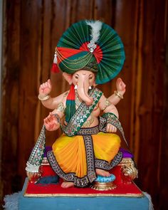 an elephant statue sitting on top of a table