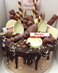 a cake with chocolate frosting and candy on top