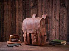 Personalized Daily Backpack, Handmade Full Grain Leather Backpack, Travel Backpack, Laptop Backpack, Men Leather Rucksack, Best Men Gift Personalization We can engrave any picture, initials, name, or logo etc on any location.  Please send picture with Etsy message and leave a note at checkout with what you would like personalized on. Features: 1. Heavy full Grain Leather, about 2.3kg in weight 2. Cotton inside lining,Brass hardware, Magnetic buttons 3. Inside zipper pocket, laptop sleeve,cell po Everyday Carry Backpack With Adjustable Strap, Waxed Finish Satchel Backpack For School, Leather Bag For Outdoor And Back To School, Back To School Leather Outdoor Bag, Leather Bags For Back To School Outdoor Use, Backpack Handmade, Daily Backpack, Everyday Backpack, Backpack Laptop