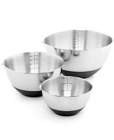 three stainless steel bowls with measuring tape on the bottom and one empty bowl in the middle