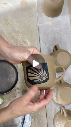 someone is making pottery with their hands