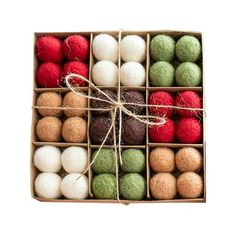 an open box filled with different colored balls