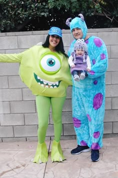 two people in costumes standing next to each other