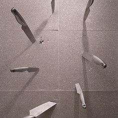 several knives are laying on the floor and broken