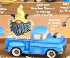 a blue truck with a gnome on the back