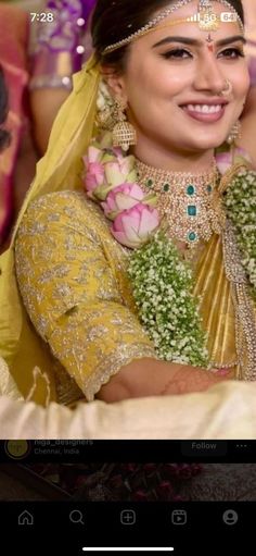 a woman in a yellow dress with flowers on her head and an elaborate necklace around her neck