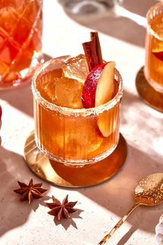 an apple cider cocktail with cinnamon and star anise