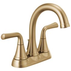 a faucet with two handles and nozzles on the side, in gold