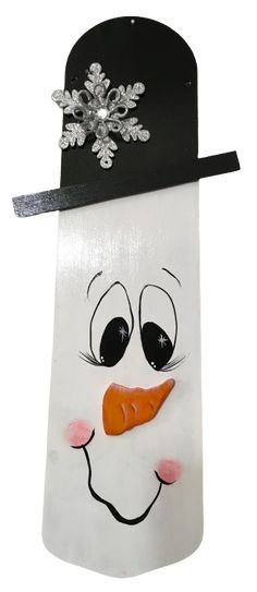 a paper bag with a snowman's face painted on it and a black hat