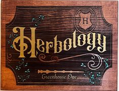 a wooden sign that says herbeoy on the front and side of it,