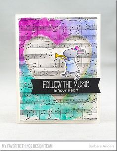 a handmade card with music notes and an elephant holding a trumpet in its mouth