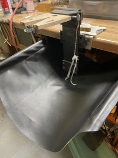 a piece of metal is being worked on in a shop