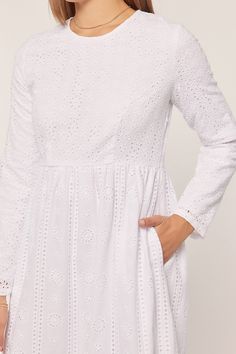 White eyelet temple dress with a round neck, keyhole back closure, long sleeves, with scalloped hem, hidden side zipper and side pockets. Self 100% Cotton, Lining 100% Polyester Hand wash in cold. Aprox. measurements in inches: XS:Length-55.5 |Bust-34 |Waist-28.5 S:Length-56 |Bust-36 |Waist-30 M:Length-56.5 |Bust-38 |Waist-32 L:Length-57 |Bust-40 |Waist-34 XL:Length-58.5 |Bust-44 |Waist-36 modest dresses, modest dress, modest midi, modest maxi, modest fashion, modest trendy dresses, modest bouti Fitted Long Sleeve Dress With Scalloped Edges, Broderie Anglaise Long Sleeve Day Dress, Long Sleeve Eyelet Dresses For Spring, Modest Long Sleeve Dress With Lace Trim, White Long Sleeve Dress With Back Zipper, White Long Sleeve Eyelet Dress, White Long Sleeve Dress With Cutwork Hem, White Long Sleeve Dress With Broderie Anglaise, Skirts Modest