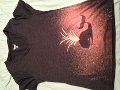 a women's v - neck shirt with an image of a whale on it