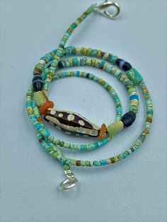 The Rare Ancient Antique Turquoise and Etched Carnelian Tinny Small Beads Necklace Probably From Historic Ancient Civilizations Very Unique Items for Collections and Study Unbelievable Hand Work For So Small Turquoise tinny Beads at That Ancient Times Fast and Free Shipping Enjoy Southwestern Green Jewelry For Beach, Southwestern Style Green Beach Jewelry, Traditional Turquoise Beads For Beach, Unique Hand-strung Turquoise Beaded Necklace, Bohemian Turquoise Pendant Beads, Spiritual Turquoise Necklace With Round Beads For Beach, Artisan Turquoise Beads, Gems, And Cabochons, Turquoise Amulet Beaded Necklaces With Natural Stones, Artisan Turquoise Beaded Necklace For Beach