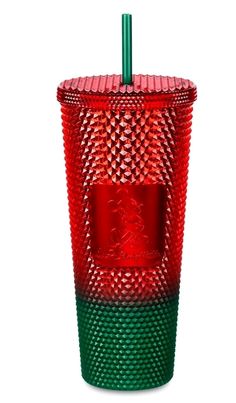 a red and green cup with a straw in it