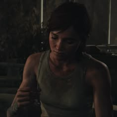 the last of us's character is looking at her cell phone in this screenshot