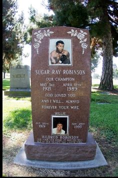 a memorial stone with a photo of a boxer on it