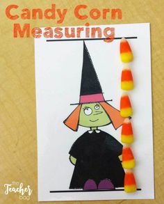 a card with candy corn and a drawing of a witch