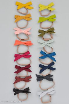 several different colors of bow ties are lined up