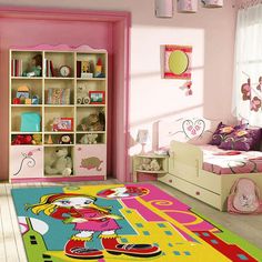 a child's bedroom with pink walls and furniture, including a large rug in the shape of a cartoon character