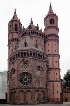 an old building with many windows and towers