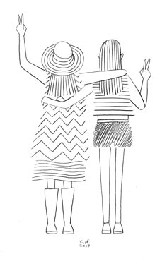 two women standing next to each other with their arms in the air