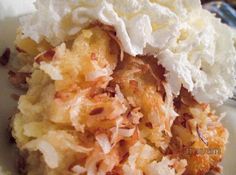 a close up of a plate of food with whipped cream and fruit toppings on top