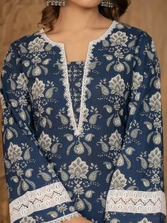 This 3-piece set includes blue cotton floral yoke print pakistani style, regular shape kurta has round neck, 3/4th sleeves, scalloped hem, calf length teamed with cotton printed trouser pants has elasticated waistband & slip on closure and a dupatta. The model wearing the size small is 5'8 in height. 3 Piece Set Color-Blue Kurta Fabric- Cotton Bottom Fabric - Cotton Dupatta Fabric-Voile Work - Floral Yoke Print detailing Neck - Round Neck Sleeves - 3/4th Sleeves Length-Calf Length Bottom - Print Trouser Designs Pakistani, Lace Neck Design, Lace Designs On Suits, Pakistani Kurta Designs, Printed Kurti Designs, Cotton Suit Designs, Simple Dress Casual, Stylish Kurtis Design, Pakistani Style