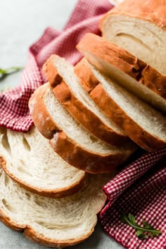 sliced bread sitting on top of a red and white checkered cloth