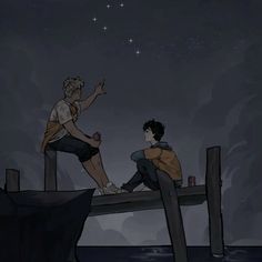 two people are sitting on a dock at night and one person is pointing to the sky