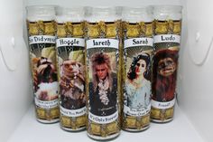 six jars filled with gold flakes and pictures of people on them in a refrigerator