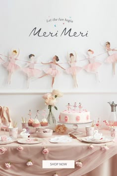 a table topped with cake and cupcakes covered in pink frosting