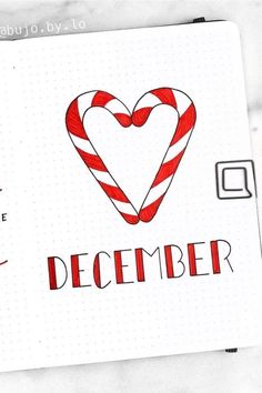 a christmas card with a candy cane heart and the words december written in red ink