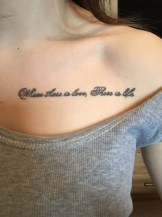 a woman with a tattoo on her shoulder saying, when this is done there is us