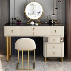 a vanity with a mirror and stool in front of it