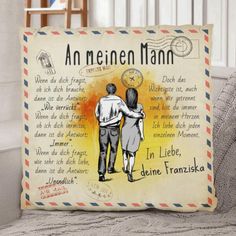 a pillow with an image of two people holding hands and the words in german on it