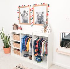 a white shelf with clothes and pictures on it