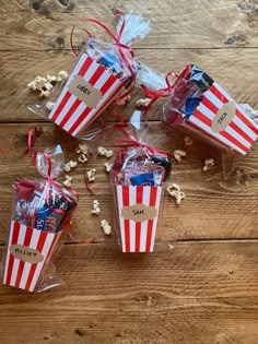 popcorn bags are wrapped in clear cellophane with red and white stripes on them