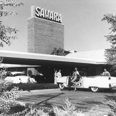 an old black and white photo of people in front of a saabra store