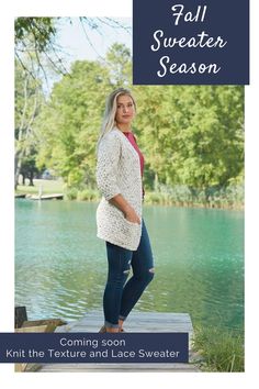 a woman standing on a dock next to a body of water with trees in the background