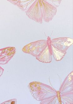 pink and gold butterflies flying in the sky