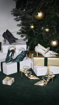 christmas presents and high heeled shoes under a tree