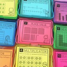 many different colored plastic boxes with numbers and fractions on them, all in the same pattern