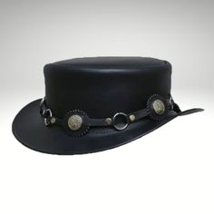 Black Short Top Hat is made from genuine leather and is perfect for keeping you cool and comfortable.  We have designed the sleek and streamlined Black Leather Top Hat to be perfect for those who prefer a simpler look.  Cowhide suede, a narrow self-leather hat strap adorns the short pointed crown. Its wide edges flare up from the sides. This product is handmade with cowhide leather and is produced by experienced craftsmen.  This product is both stylish and durable. Our products are of the highes Fitted Black Leather Hat, Black Fitted Leather Hat, Black Leather Hat For Outdoor, Black Hat With Adjustable Leather Sweatband, Adjustable Black Hat With Leather Sweatband, Black Adjustable Hat With Leather Sweatband, Black Leather Hat With Leather Patch, Classic Leather Top Hat With Wide Brim, Fitted Leather Top Hat With Short Brim