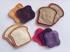 four pieces of toasted bread with different colors