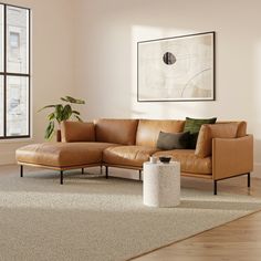 a living room with a brown leather couch