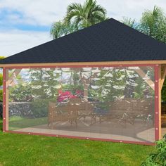 a gazebo in the middle of a grassy area with flowers and trees around it